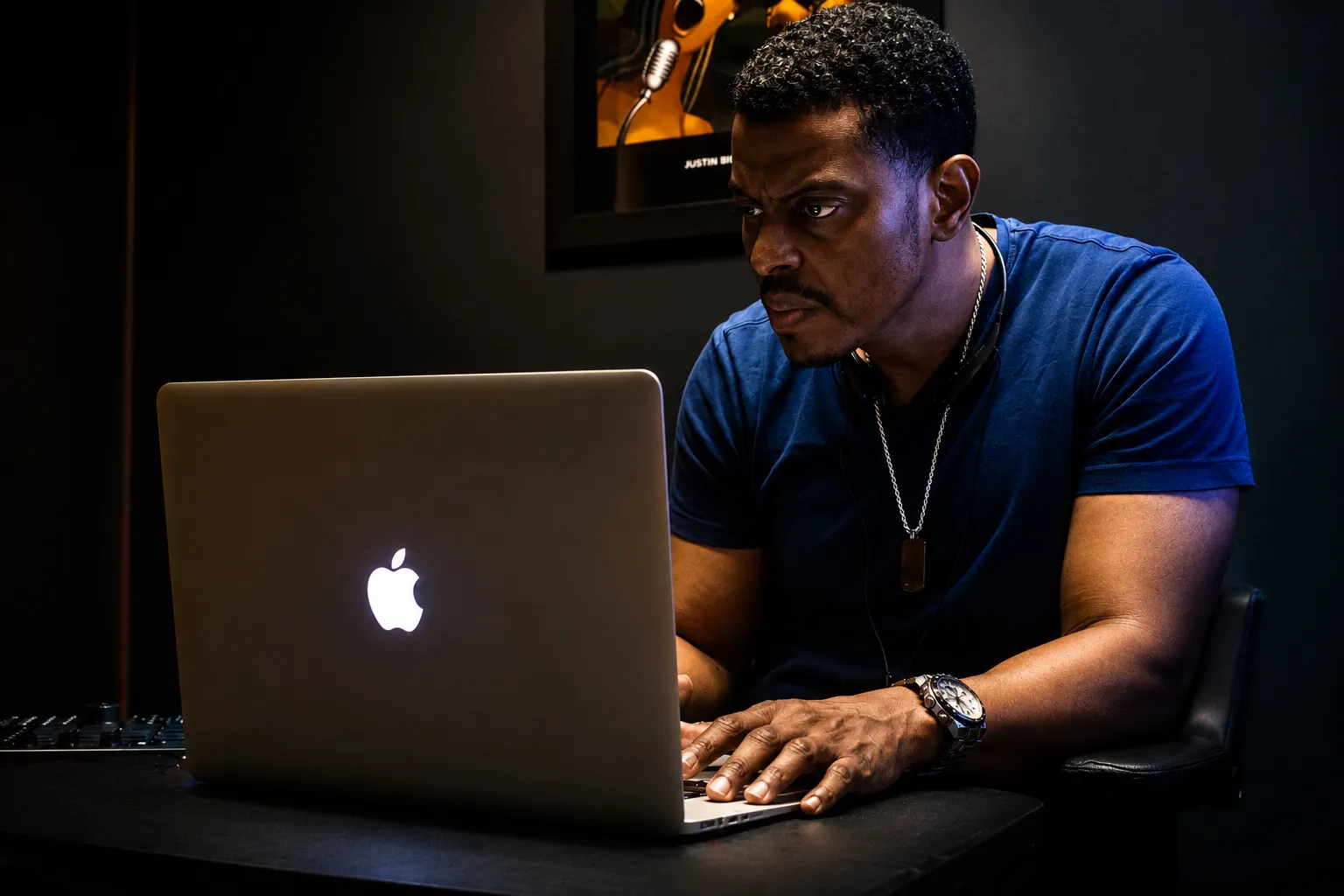 Karl Antoine producing at laptop