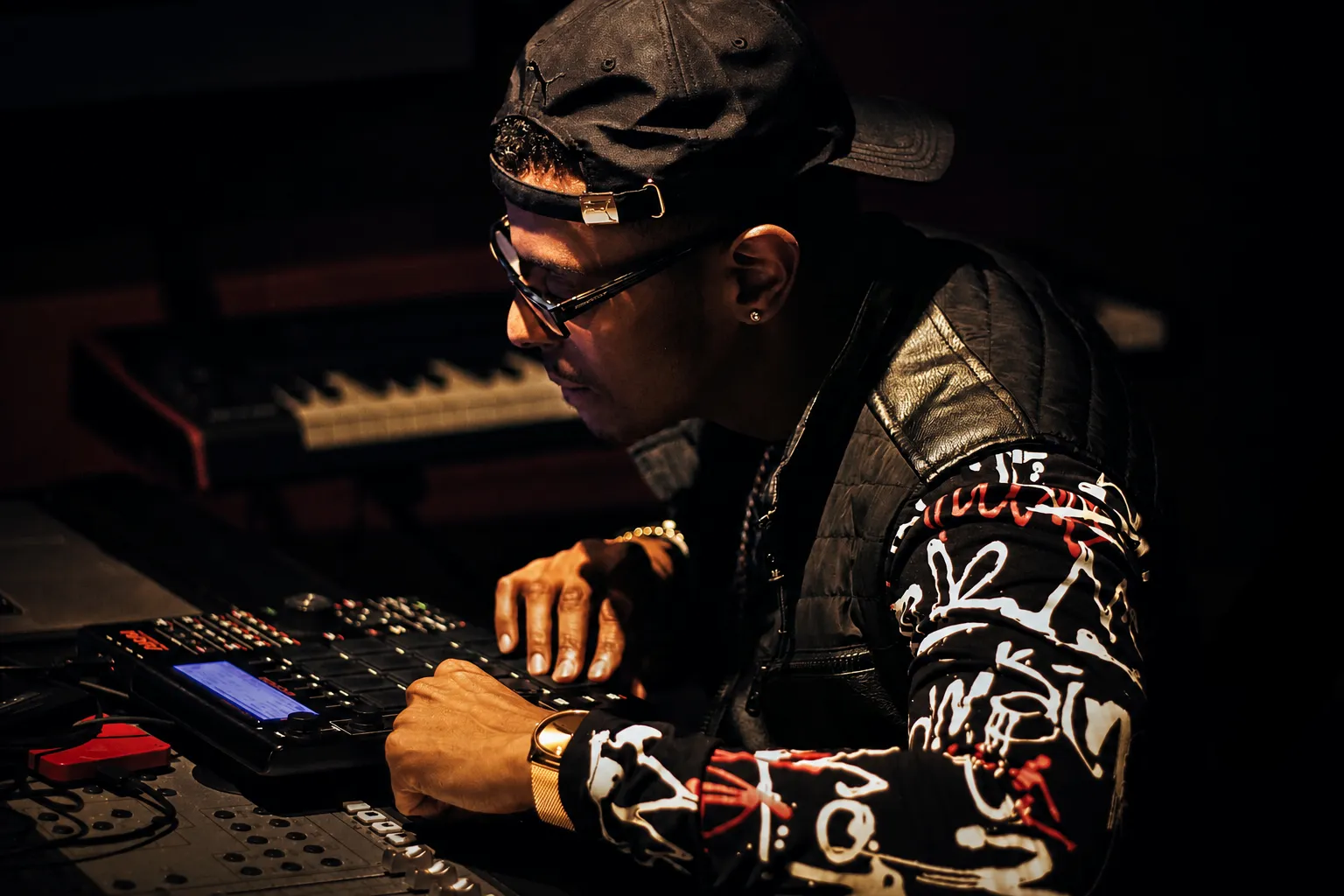 Producer working on music equipment